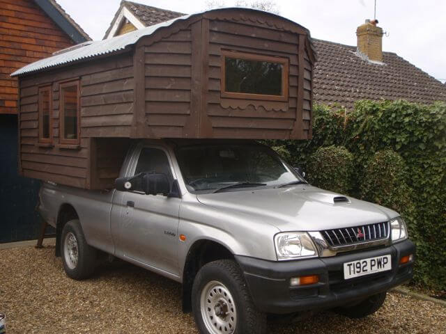 A homemade truck camper that is a work of art