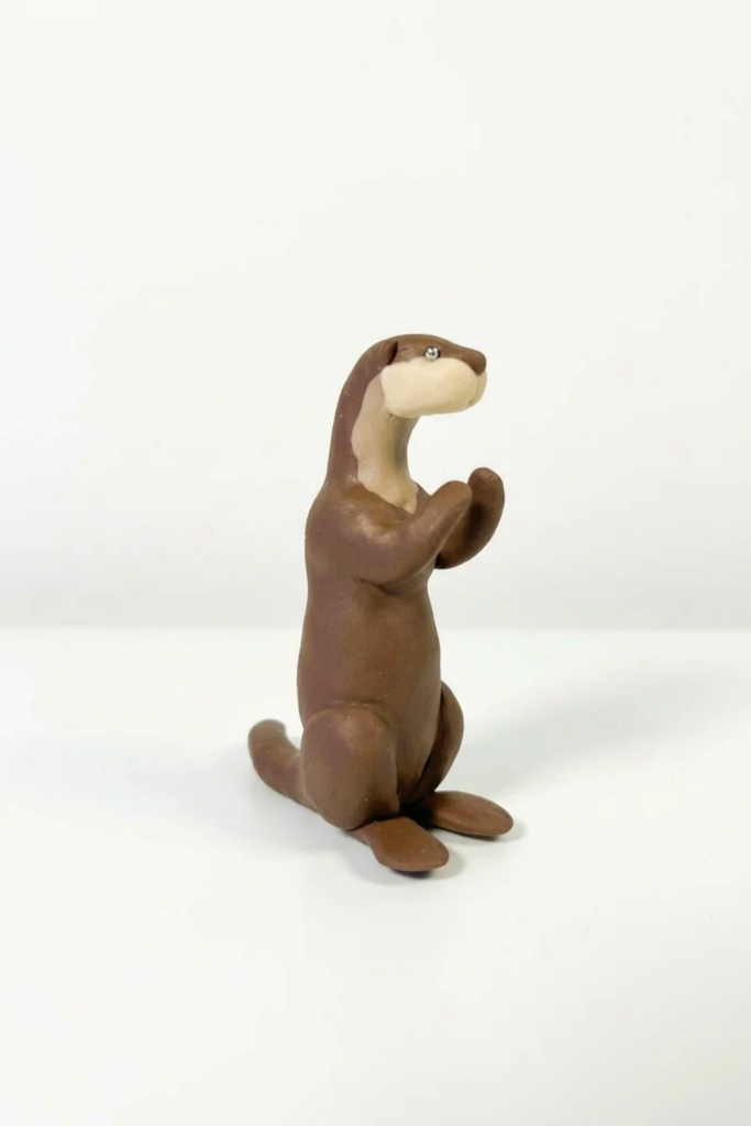 Sculpting Adorable Polymer Clay Otters Final Image